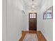 Bright foyer with hardwood floors, elegant light fixture, and stylish decor at 104 Anderson Park Dr, Wake Forest, NC 27596