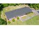 Aerial view of the home with a fenced backyard and mature trees at 1041 Davis Dr, Apex, NC 27523