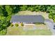Aerial view of the home with a fenced backyard and mature trees at 1041 Davis Dr, Apex, NC 27523