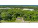An aerial view of the home featuring mature trees surrounding property at 1041 Davis Dr, Apex, NC 27523