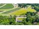 Aerial view of a property with large land, farmland, and trees at 1041 Davis Dr, Apex, NC 27523