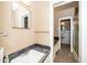Bathroom features a marble countertop, sink, and mosaic floors at 1041 Davis Dr, Apex, NC 27523