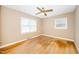 Bedroom featuring hardwood floors, ceiling fan, and natural light at 1041 Davis Dr, Apex, NC 27523