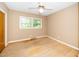 Bedroom with hardwood floors, fan, and natural lighting at 1041 Davis Dr, Apex, NC 27523