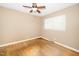 This bedroom features neutral walls, hardwood floors, and a ceiling fan at 1041 Davis Dr, Apex, NC 27523