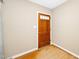 Warm entryway with a wooden front door, hardwood floors, and neutral wall color at 1041 Davis Dr, Apex, NC 27523