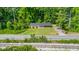 Home exterior featuring a well maintained lawn and mature trees at 1041 Davis Dr, Apex, NC 27523