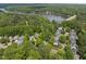 A picturesque view overlooking lakeside homes nestled among lush trees, next to a calm waterway at 105 Sundew Ln, Cary, NC 27518