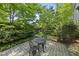 Charming backyard patio with lush landscaping and a quaint bistro set at 105 Sundew Ln, Cary, NC 27518