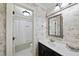 Classic bathroom with marble-style wallpaper, shower/tub combination, and bright lighting at 105 Sundew Ln, Cary, NC 27518