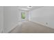 Bright bedroom with neutral carpet and a large window offering a pleasant view at 105 Sundew Ln, Cary, NC 27518