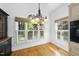 Sunny breakfast nook area with large window and a view of the backyard at 105 Sundew Ln, Cary, NC 27518