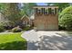 Charming two-story brick home featuring a two-car garage and beautifully landscaped front yard at 105 Sundew Ln, Cary, NC 27518