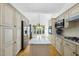 Modern kitchen with stainless steel appliances, granite countertops and a center island at 105 Sundew Ln, Cary, NC 27518