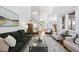 Spacious living room featuring hardwood floors and a staircase at 105 Sundew Ln, Cary, NC 27518