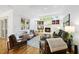 Bright living room with a fireplace, built-in shelves, and hardwood floors at 105 Sundew Ln, Cary, NC 27518