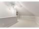 Finished attic features neutral carpet and white door at 106 Clendenen Ct, Cary, NC 27513