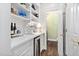 Butler's pantry features shelving, hardwood floors, and a mini refrigerator at 106 Clendenen Ct, Cary, NC 27513