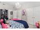 Bedroom with a chandelier, pink accents and an ensuite bathroom at 106 Clendenen Ct, Cary, NC 27513