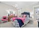 Bedroom featuring chandelier, white walls, a navy bedspread, and light colored carpet at 106 Clendenen Ct, Cary, NC 27513