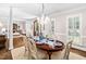 Chic dining room with chandelier, seating for six, hardwood floors and natural light at 106 Clendenen Ct, Cary, NC 27513
