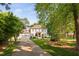 Elegant two-story home with a well-manicured lawn, complemented by mature trees at 106 Clendenen Ct, Cary, NC 27513