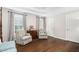 A secondary view of the main bedroom with hardwood floors, tray ceiling and neutral walls at 106 Clendenen Ct, Cary, NC 27513