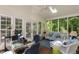 Charming screened-in porch with comfortable seating, perfect for enjoying the outdoors in any weather at 106 Clendenen Ct, Cary, NC 27513