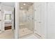 Modern shower with tile surround, glass door and multiple shower heads at 106 Clendenen Ct, Cary, NC 27513