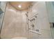 Close up on tile shower features multiple shower heads and glass door at 106 Clendenen Ct, Cary, NC 27513