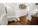 Elegant stairway with hardwood floors and natural light, connecting different levels of the home at 106 Clendenen Ct, Cary, NC 27513