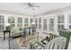 Inviting sunroom with large windows, plush seating, and elegant decor, ideal for enjoying natural light at 106 Clendenen Ct, Cary, NC 27513