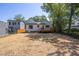 Expansive backyard featuring a well-maintained lawn and a charming wooden deck at 107 N Guthrie Ave, Durham, NC 27703
