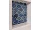 Close-up of a stylish blue-toned mosaic tile inset on a bright white shower wall at 107 N Guthrie Ave, Durham, NC 27703