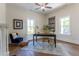 Inviting home office with natural light, a blue accent chair, and patterned rug at 107 N Guthrie Ave, Durham, NC 27703