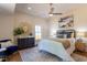 Bedroom with a ceiling fan, hardwood floors, an ornamental mirror, and coordinated furniture at 107 N Guthrie Ave, Durham, NC 27703