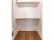 Bright closet features hardwood floors and shelving for storage at 107 N Guthrie Ave, Durham, NC 27703