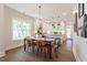 Well-lit dining area showcases a modern chandelier and seamless flow to the kitchen at 107 N Guthrie Ave, Durham, NC 27703