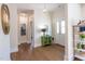Bright foyer with hardwood floors, stylish lighting, and a view into other rooms at 107 N Guthrie Ave, Durham, NC 27703