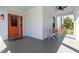 Comfortable front porch features stylish seating and an orange front door at 107 N Guthrie Ave, Durham, NC 27703