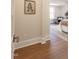 Hallway view leading to a bedroom with a comfortable bed and stylish decor at 107 N Guthrie Ave, Durham, NC 27703