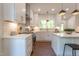 Modern kitchen with white cabinets, stainless steel appliances, and an island perfect for entertaining at 107 N Guthrie Ave, Durham, NC 27703