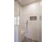 Close-up of the tiled shower with a glass door and black-and-white patterned tile floor at 107 N Guthrie Ave, Durham, NC 27703