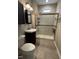 Bathroom featuring a new shower with seat, dark cabinets and tile flooring at 110 Bristolwood Cir, Morrisville, NC 27560