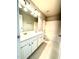 Bathroom featuring double sink vanity, large mirror, and shower-tub combo at 110 Bristolwood Cir, Morrisville, NC 27560