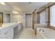 This bathroom has double sinks, a glass enclosed shower and a separate soaking tub with tile surround at 110 Bristolwood Cir, Morrisville, NC 27560