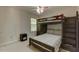 Neutral bedroom features a bunk bed, ceiling fan and natural light at 110 Bristolwood Cir, Morrisville, NC 27560