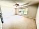 Spacious bedroom featuring neutral carpet, ceiling fan, and a bright window at 110 Bristolwood Cir, Morrisville, NC 27560