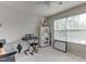 Bedroom with a desk and chair, bookshelf, and large window at 110 Bristolwood Cir, Morrisville, NC 27560