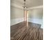 Formal dining room featuring wainscoting, a chandelier, and wood floors at 110 Bristolwood Cir, Morrisville, NC 27560